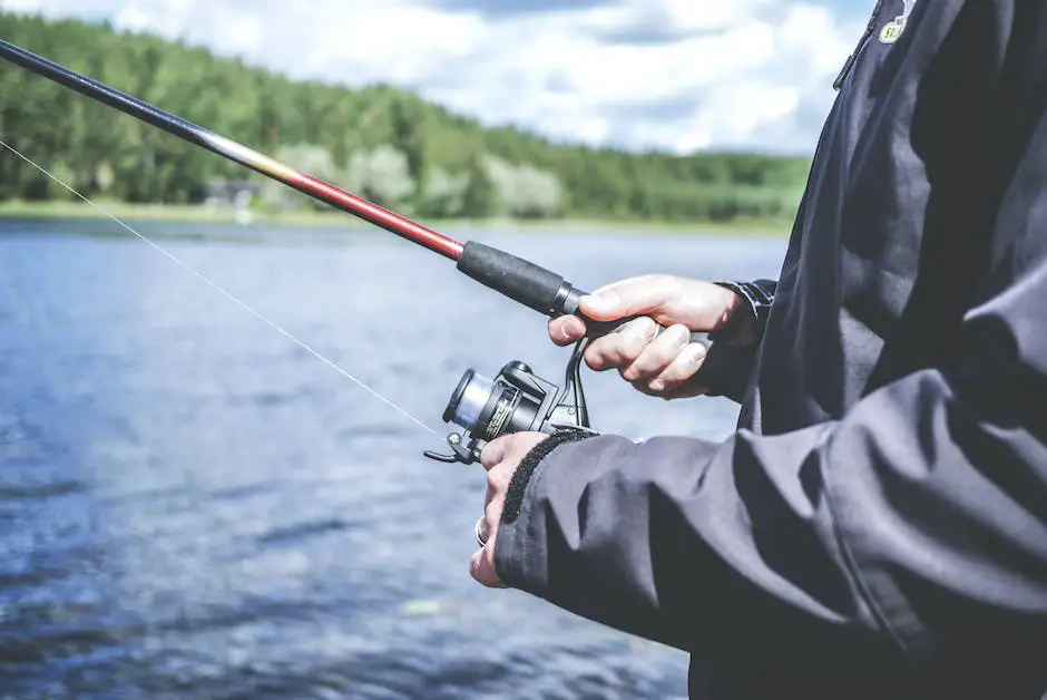 A person holding a fishing rod along the bank of a river in the Amazon, with dense rainforest in the background